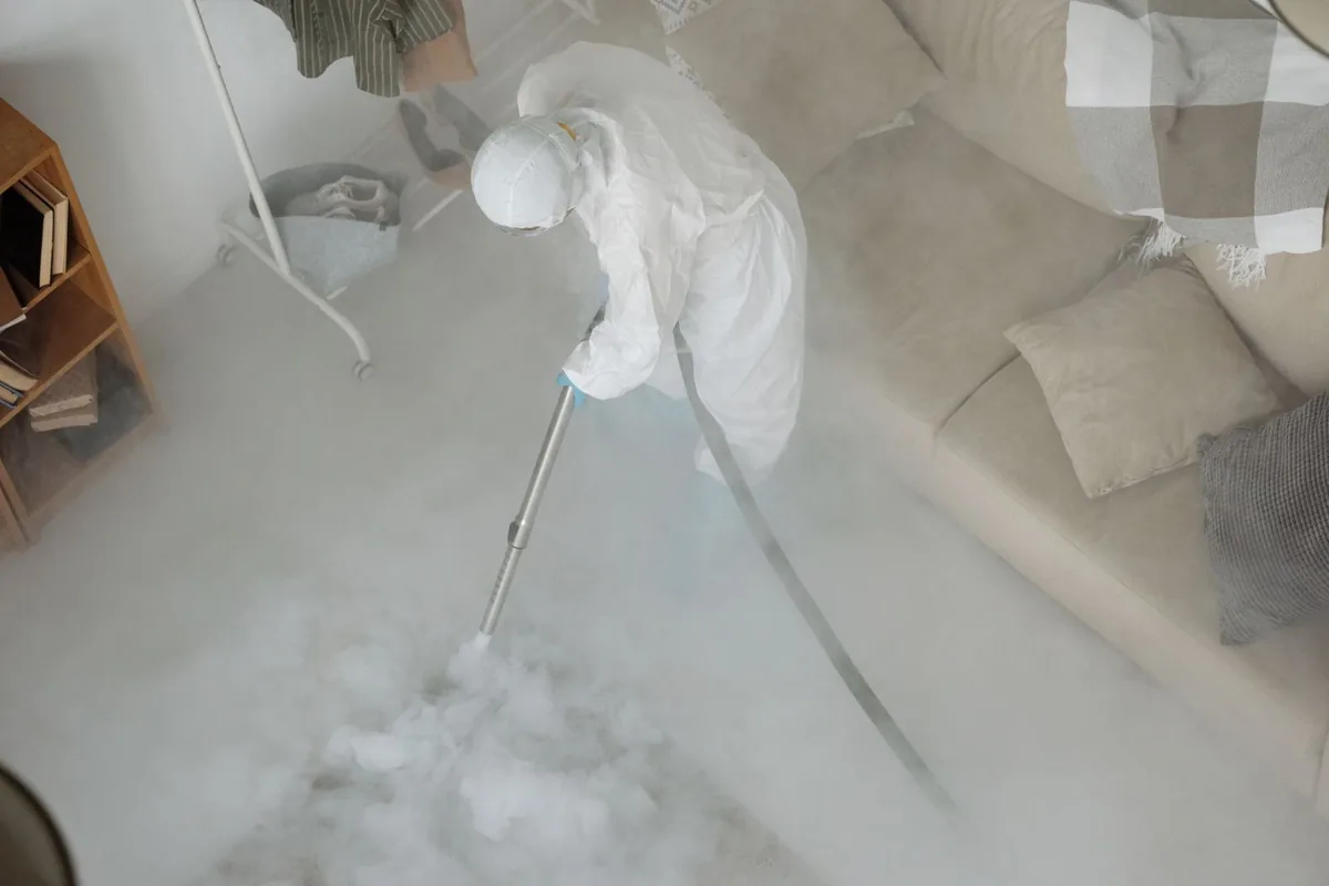 Biohazard cleanup technician in protective equipment, Kennebunkport, ME